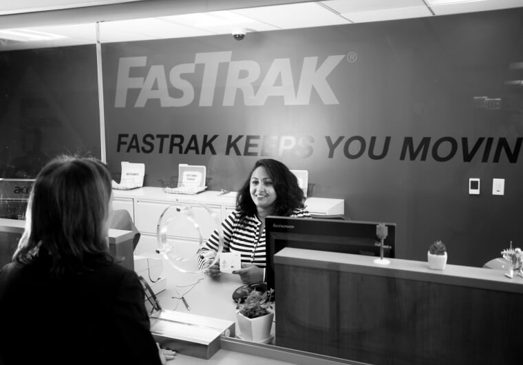 Fastrak front desk attending customer