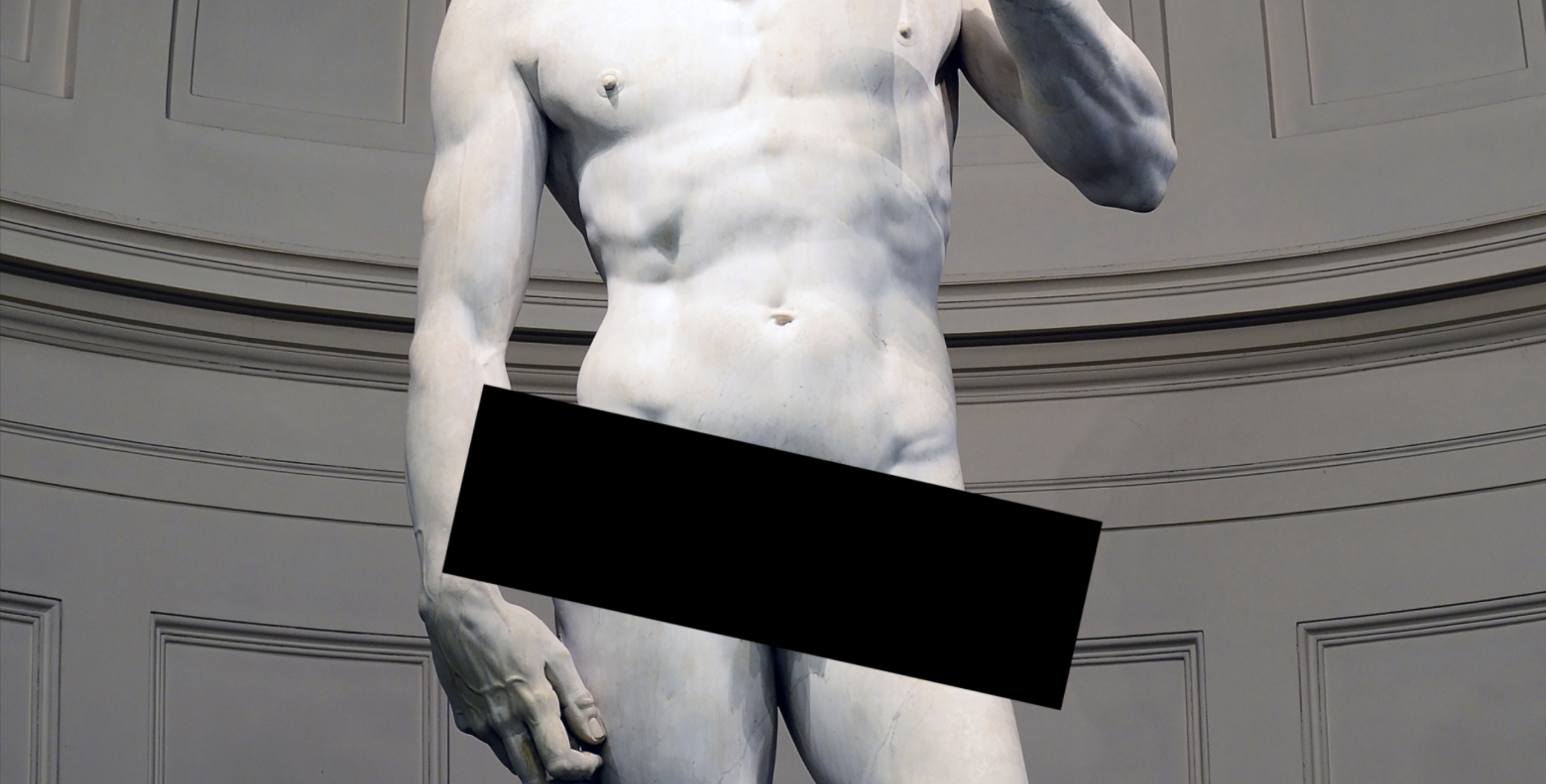 Photo of the stone Statue of David's torso with a censor bar over his hips