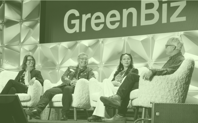 Four people in lounge chairs on a stage speaking at a GreenBiz event
