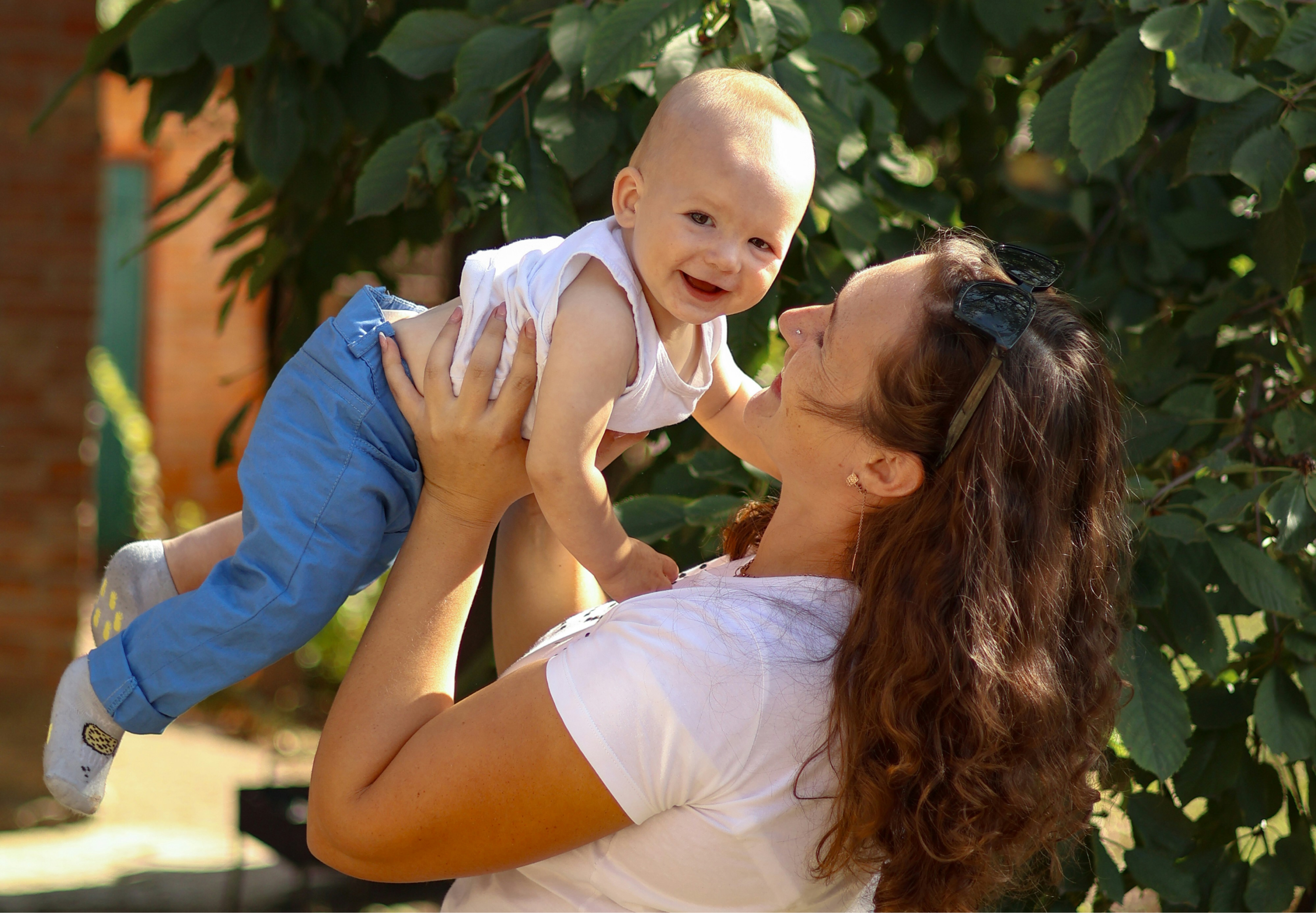 Woman lifting her baby