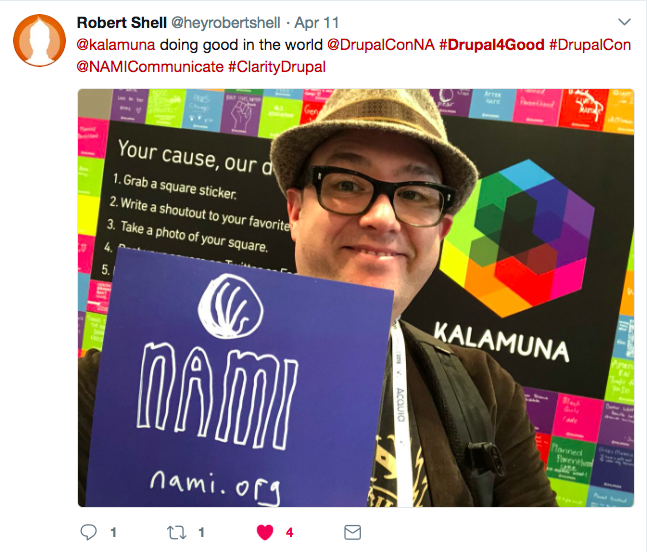 Robert holds up a sticker that reads NAMI.org